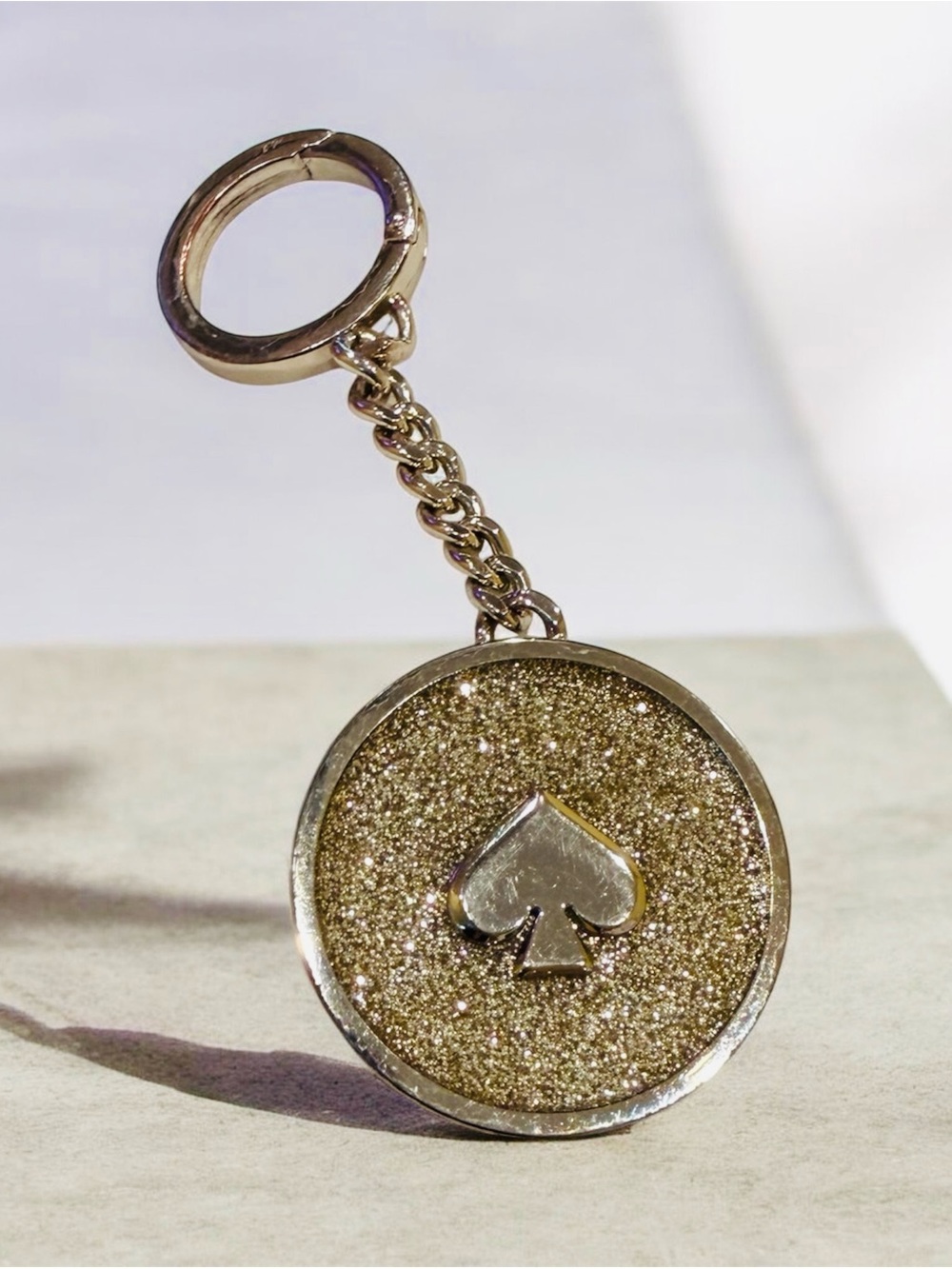 kate spade Gold Glitter Spade Disc Keychain